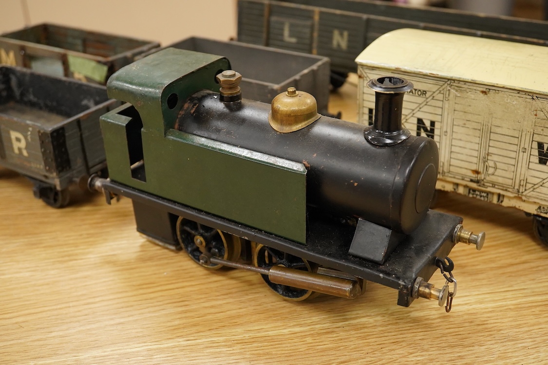 A Gauge One live steam 0-4-0T locomotive in the style of a Bowman model locomotive, with spirit fired with two simple outside oscillating cylinders, together with five LNWR and Midland Railway freight wagons, including a